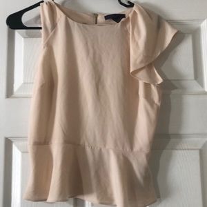 Beige blouse . Gold zipper on back